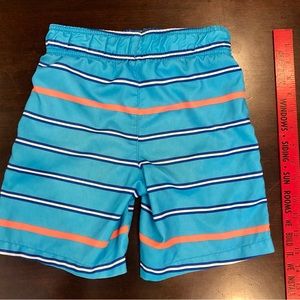 OP Boys XS Blue With Dark Blue, White, And Orange Strips Swim Trunks